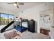 Comfortable bedroom features bunk beds with slide, carpet, a ceiling fan, a dresser, and an open doorway at 630 S Boulder Ct, Gilbert, AZ 85296