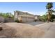 Home featuring a three-car garage, desert landscaping, and concrete driveway at 630 S Boulder Ct, Gilbert, AZ 85296