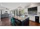 The kitchen features a granite countertop island with bar seating, stainless appliances, and an open floor plan at 630 S Boulder Ct, Gilbert, AZ 85296