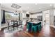 This bright kitchen features a large island with seating, stainless appliances and a view of the dining area at 630 S Boulder Ct, Gilbert, AZ 85296