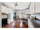 The laundry room is equipped with front load washer and dryer, custom cabinets and a workspace with granite counters at 630 S Boulder Ct, Gilbert, AZ 85296