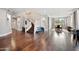 Open-concept living area with hardwood floors, a staircase, and views into the dining area at 630 S Boulder Ct, Gilbert, AZ 85296