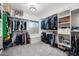 Spacious walk-in closet with custom shelving and ample storage space at 630 S Boulder Ct, Gilbert, AZ 85296