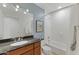 Comfortable bathroom with tile flooring, granite countertops, and a bathtub with a shower at 6803 E Main St # 1106, Scottsdale, AZ 85251