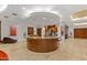 Common area with coffee bar featuring wood counters, cabinets, and tiled flooring at 6803 E Main St # 1106, Scottsdale, AZ 85251