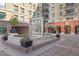 Beautiful community courtyard featuring a lovely water feature, mature trees, and resident parking access at 6803 E Main St # 1106, Scottsdale, AZ 85251
