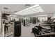 Large gym with mirrored wall, exercise equipment, weight machines and a rubberized floor at 6803 E Main St # 1106, Scottsdale, AZ 85251