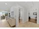 Inviting hallway leading to a bathroom and office, plus views of the dining and living areas at 6803 E Main St # 1106, Scottsdale, AZ 85251
