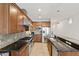 Stylish kitchen with stainless steel appliances, granite countertops, tiled backsplash, and tile flooring at 6803 E Main St # 1106, Scottsdale, AZ 85251