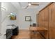Bright home office with hardwood floors, built in storage, and a sleek work space at 6803 E Main St # 1106, Scottsdale, AZ 85251