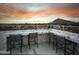Rooftop outdoor bar with marble countertop and seating featuring beautiful mountain and city views at 6803 E Main St # 1106, Scottsdale, AZ 85251