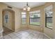 Light filled dining area with a decorative chandelier and a view of the backyard at 7009 W Taro Ln, Glendale, AZ 85308