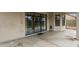 Covered patio showcasing seamless access through large sliding glass doors at 7009 W Taro Ln, Glendale, AZ 85308