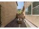 Cozy backyard with stone pavers, a built-in barbecue, and a modern fire pit at 7138 W Kent Dr, Chandler, AZ 85226