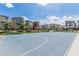 Community basketball court surrounded by modern homes on a beautiful, sunny day at 7138 W Kent Dr, Chandler, AZ 85226