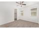 Bedroom includes carpeted floors, two bright windows, and a closet at 7138 W Kent Dr, Chandler, AZ 85226