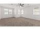 Spacious bedroom featuring neutral paint, plush carpet, and plentiful bright windows at 7138 W Kent Dr, Chandler, AZ 85226