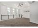 An upstairs bonus room features multiple windows, carpet floors, and a ceiling fan at 7138 W Kent Dr, Chandler, AZ 85226
