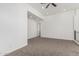 An upstairs bonus room features recessed lighting and neutral walls and flooring at 7138 W Kent Dr, Chandler, AZ 85226