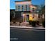 Stylish two-story house with modern design elements and appealing textures, complemented by neat landscaping and exterior lighting at 7138 W Kent Dr, Chandler, AZ 85226