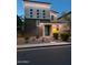 Inviting two-story home with a blend of textures, showcasing a modern design and well-lit entrance, offering curb appeal at 7138 W Kent Dr, Chandler, AZ 85226