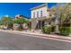Contemporary home featuring mixed textures, a blue front door, and landscaped front yard at 7138 W Kent Dr, Chandler, AZ 85226