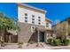 Modern two-story home showcasing a mixed material exterior with brick accents, xeriscaping and a welcoming entrance at 7138 W Kent Dr, Chandler, AZ 85226