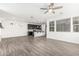 Living space blending seamlessly with kitchen; featuring modern finishes, tile floors, and a cozy, open ambiance at 7138 W Kent Dr, Chandler, AZ 85226