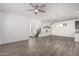 Spacious living room with neutral tones, tile flooring, and a unique playhouse feature under the staircase at 7138 W Kent Dr, Chandler, AZ 85226