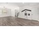 Bright living area featuring stylish flooring, a ceiling fan, and a whimsical playhouse built into the wall at 7138 W Kent Dr, Chandler, AZ 85226