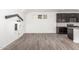 Open-concept living area with tile flooring, a distinctive built-in playhouse, and seamless flow to the kitchen at 7138 W Kent Dr, Chandler, AZ 85226