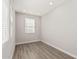 Bright home office showcasing gray walls, recessed lighting, and wood-look flooring at 7138 W Kent Dr, Chandler, AZ 85226