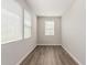 Bright home office featuring gray walls, recessed lights, and modern wood-look floors at 7138 W Kent Dr, Chandler, AZ 85226