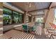 Covered outdoor dining space with tables, chairs, and modern architectural design at 7138 W Kent Dr, Chandler, AZ 85226