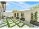Private backyard with modern landscaping, decorative stone, and a cozy seating area at 7330 E Vista Bonita Dr, Scottsdale, AZ 85255
