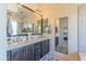 Stylish bathroom featuring double sinks, modern fixtures, and decorative mirrors for a spa-like experience at 7330 E Vista Bonita Dr, Scottsdale, AZ 85255