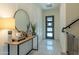 Stylish entryway featuring modern decor, a decorative mirror, and a staircase at 7330 E Vista Bonita Dr, Scottsdale, AZ 85255