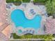 Aerial view of a large community pool, spa, and patio area with lounge chairs and tables at 7330 E Vista Bonita Dr, Scottsdale, AZ 85255