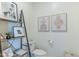 Charming powder room with decorative shelves, artwork, and stylish fixtures for a welcoming touch at 7330 E Vista Bonita Dr, Scottsdale, AZ 85255