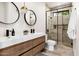 Stylish bathroom features floating vanity, dual sinks, and a glass walk-in shower at 7670 E Sierra Vista Dr, Scottsdale, AZ 85250