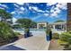 Community pool surrounded by lounge furniture, green planters, and landscaped grounds on a sunny day at 7670 E Sierra Vista Dr, Scottsdale, AZ 85250