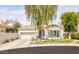 Charming single-story home featuring a tiled roof, desert landscaping, and a spacious two-car garage at 7670 E Sierra Vista Dr, Scottsdale, AZ 85250