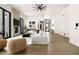 Bright living room boasts modern fireplace, large windows, and open floor plan at 7670 E Sierra Vista Dr, Scottsdale, AZ 85250