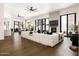 Bright, open living room with hardwood floors, modern fireplace, and expansive sliding glass doors at 7670 E Sierra Vista Dr, Scottsdale, AZ 85250