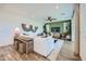 Open living room with plush seating, stylish decor, wood-look floors, and access to outdoor living space at 8259 E Petunia Ave, Mesa, AZ 85212