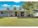 Large backyard showing a covered patio with laundry hookups and an expansive lawn at 8319 E Indianola Ave, Scottsdale, AZ 85251