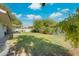 Expansive backyard with lush green grass and shaded patio area at 8319 E Indianola Ave, Scottsdale, AZ 85251