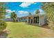 Spacious backyard featuring a covered patio and a well-maintained lawn at 8319 E Indianola Ave, Scottsdale, AZ 85251