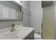 Well-lit bathroom with a modern vanity, glass shower, and shuttered window for a clean, updated look at 8319 E Indianola Ave, Scottsdale, AZ 85251
