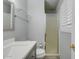Clean bathroom featuring a vanity, frameless glass shelf, toilet, and walk-in shower at 8319 E Indianola Ave, Scottsdale, AZ 85251